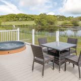 Beautiful lake views and sunken hot tubs at Florence Springs Luxury Lakeside Lodges - Tenby, Pembrokeshire, South Wales