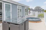 Private decking with sunken hot tubs at Florence Springs Luxury Lakeside Lodges - Tenby, Pembrokeshire, South Wales